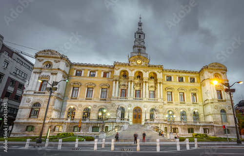 Fotografie Bilbao city council at dusk with cloudy sky