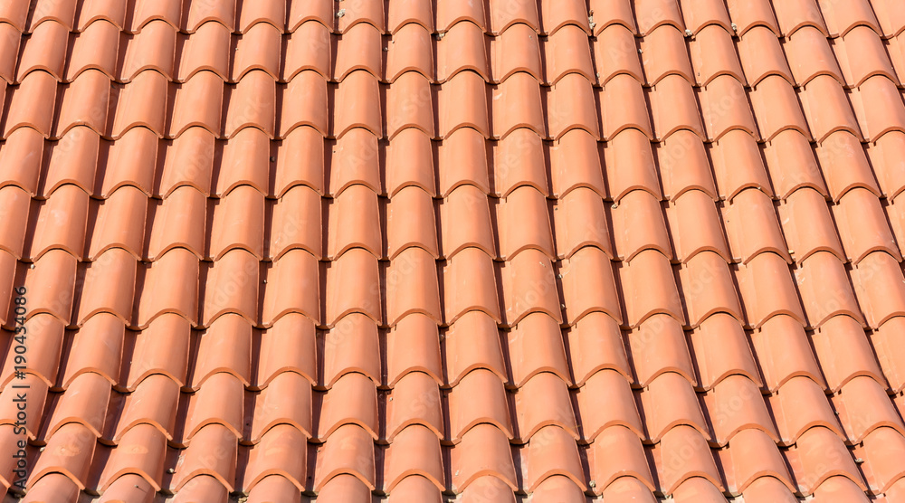 Texture of orange roof tiles of a new roof Texture of orange roof tiles of a new roof