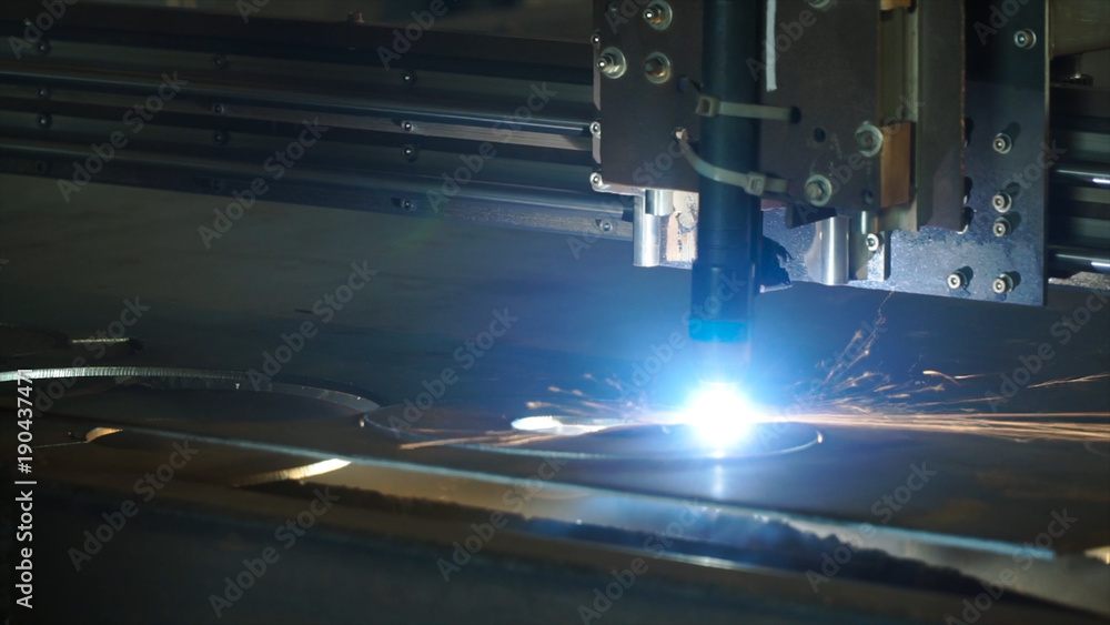 The industrial laser cutting torch cuts preparations from metal. Clip