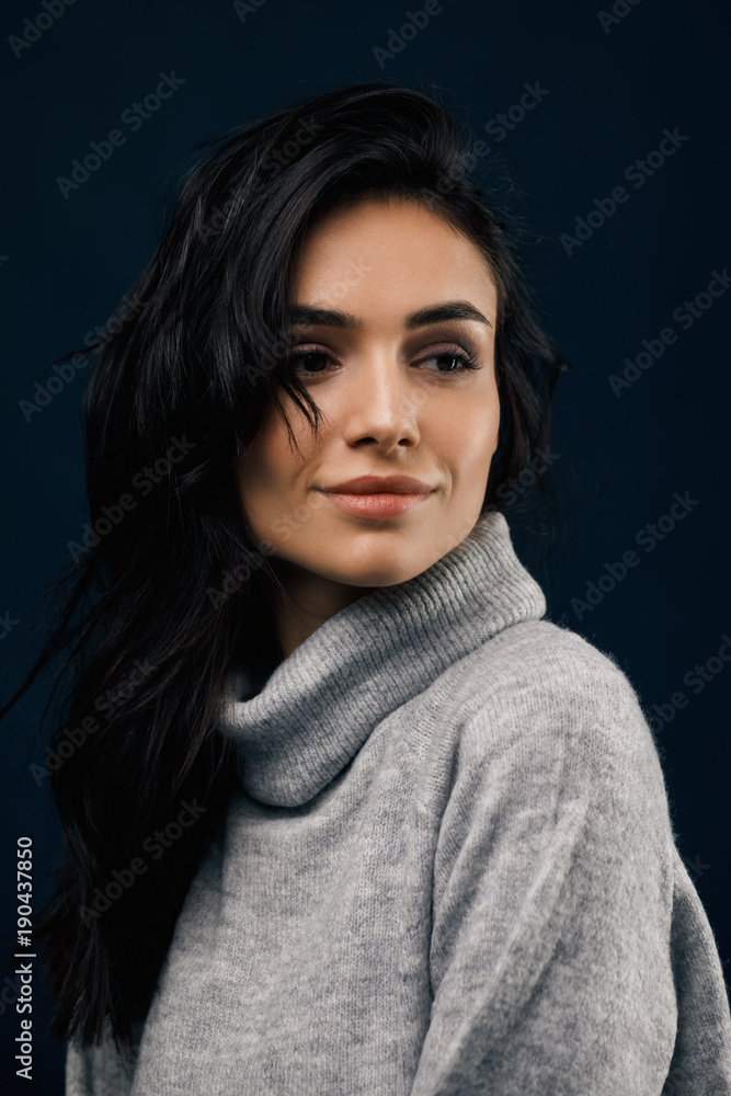 Close up portrait of a young caucasian woman looking away in studio Close up portrait of a young caucasian woman looking away in studio