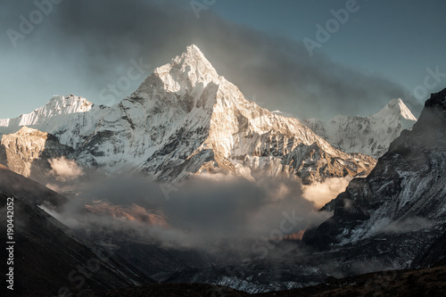 Ama Dablam mountain. Sun illuminates slopes. Himalayan mountains, Nepal. photo