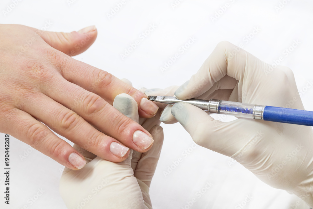 The process of the master's work in the manicure salon of female nails The process of the master's work in the manicure salon of female nails