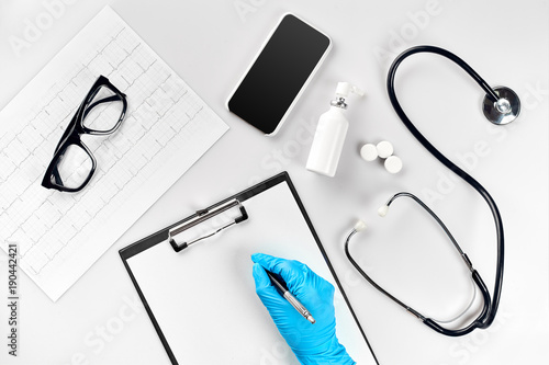 Doctor s table, tools, medical instruments,stethoscope, work in hospital on white background flat lay photo