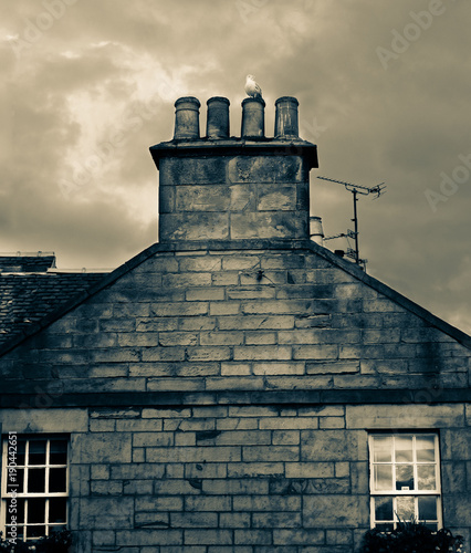 The small Scottish town of St Andrews is extremely winding. masonry, gulls and chimneys mainly shape the cityscape. photo