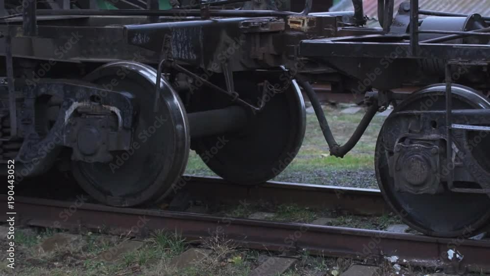 Wheels of the train Metal large wheels of a heavy freight train car Wheels of the train Metal large wheels of a heavy freight train car