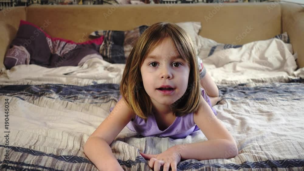 A girl with blonde hair and pigtails, of European or American ...