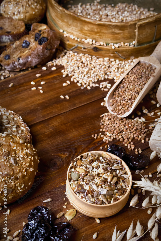 Fototapeta premium Assortment of baked bread on wooden table background