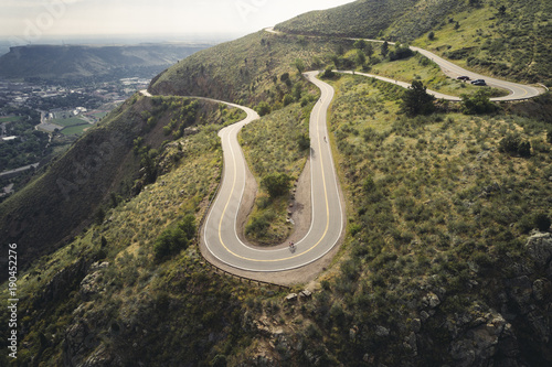 High angle view of people riding bicycles on mountain road