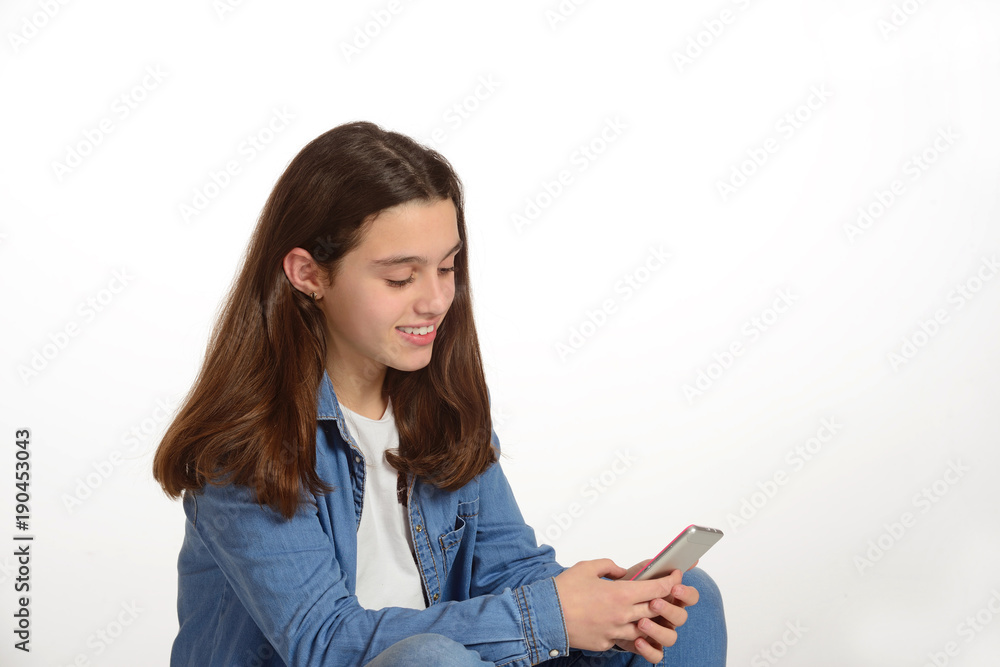 Young teenager connected to the internet with his mobile. Young teenager connected to the internet with his mobile.
