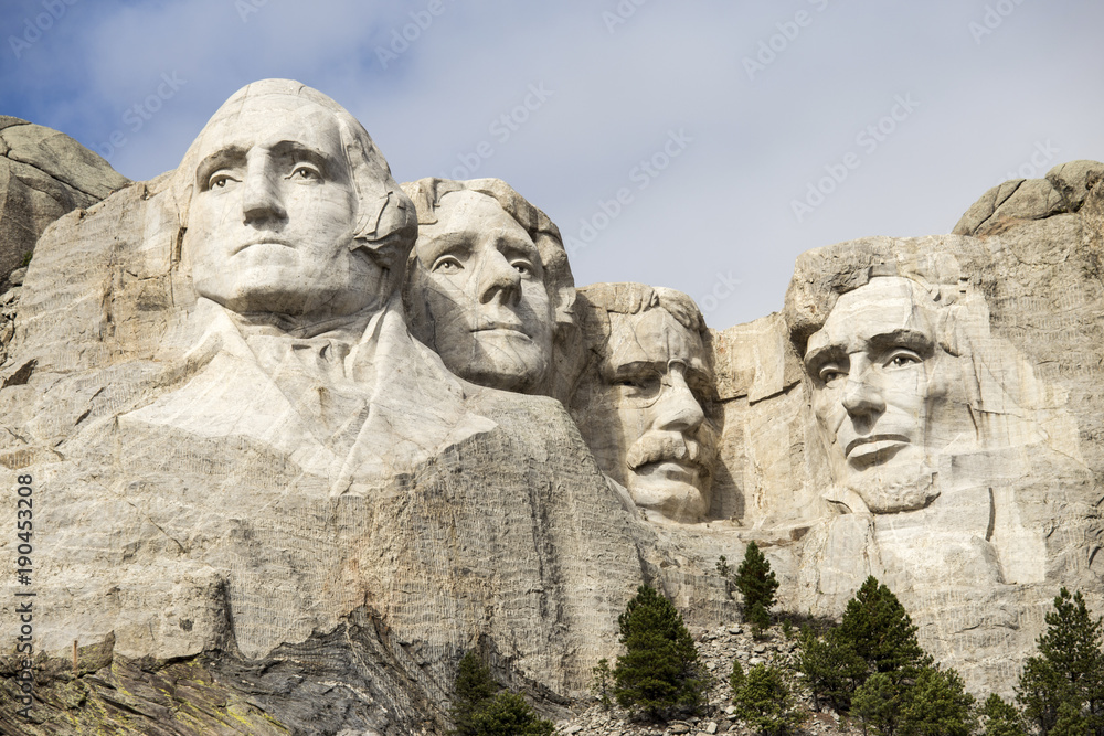 Low angle view of Mount Rushmore National Memorial against sky Low angle view of Mount Rushmore National Memorial against sky