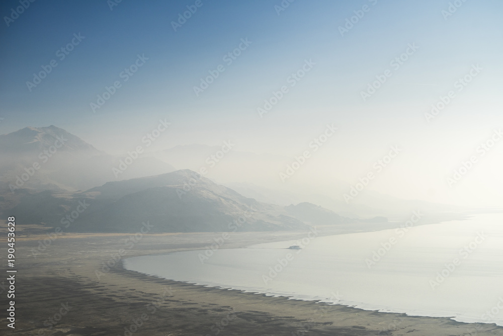 Scenic view of beach against sky during foggy weather Scenic view of beach against sky during foggy weather