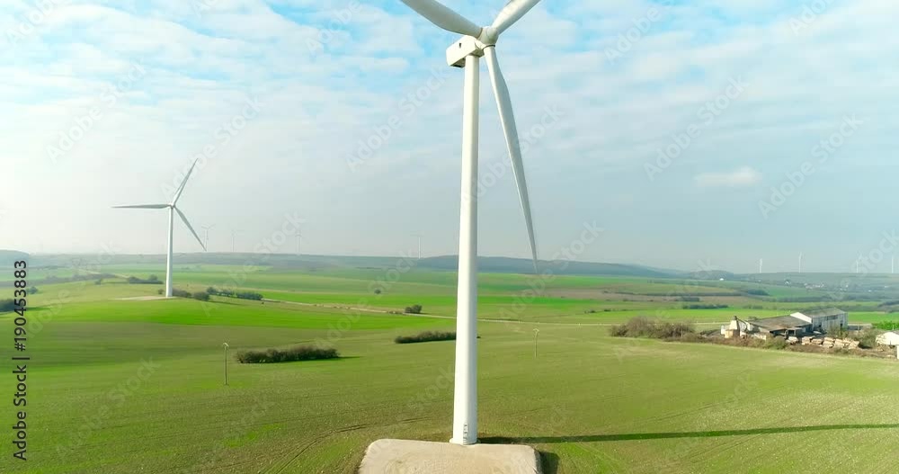 Aerial drone view on Wind Power, Turbine, Windmill, Energy Production. Green technology, a clean and renewable energy solution Aerial drone view on Wind Power, Turbine, Windmill, Energy Production. Green technology, a clean and renewable energy solution