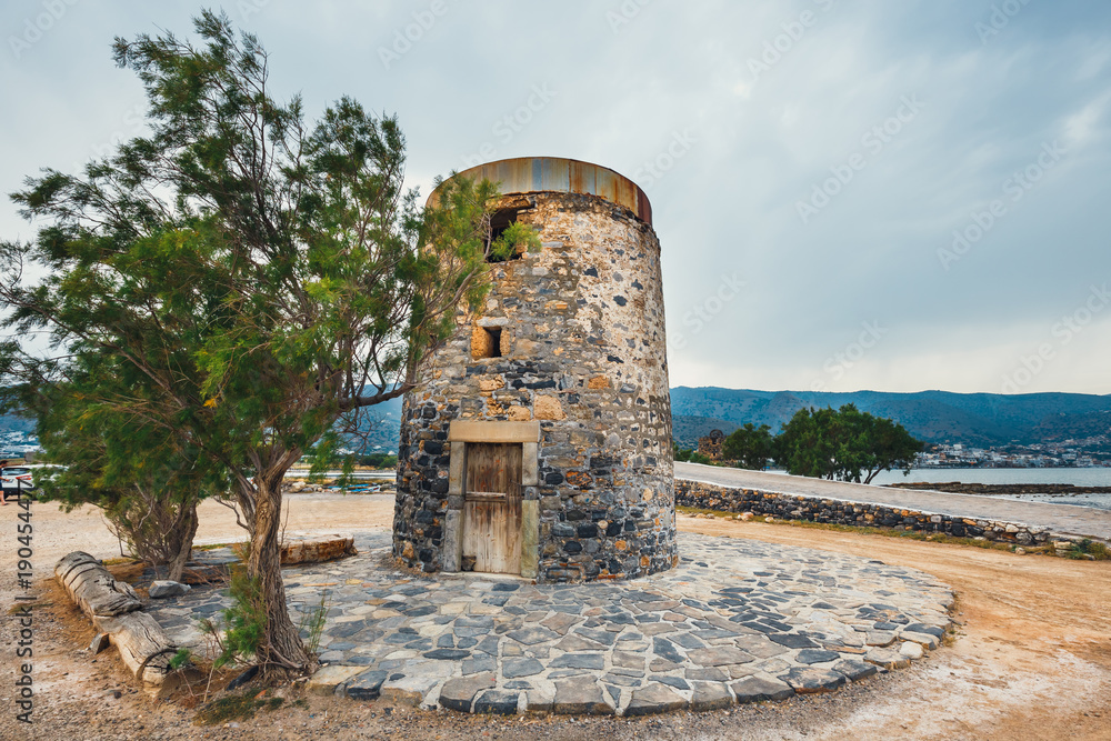 Ancient windmill on Kalydon Peninsula near Agios Nikolaos, Crete, Greece