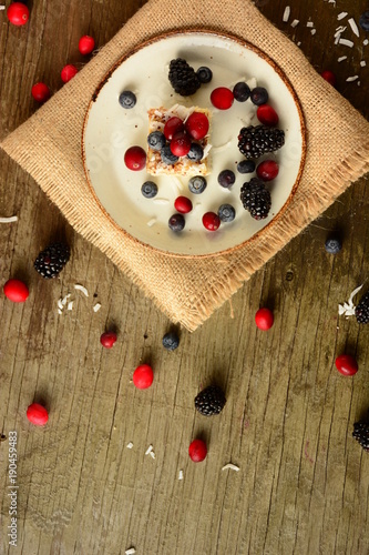 Piece of cake napoleon on a plate with sweet fresh berries