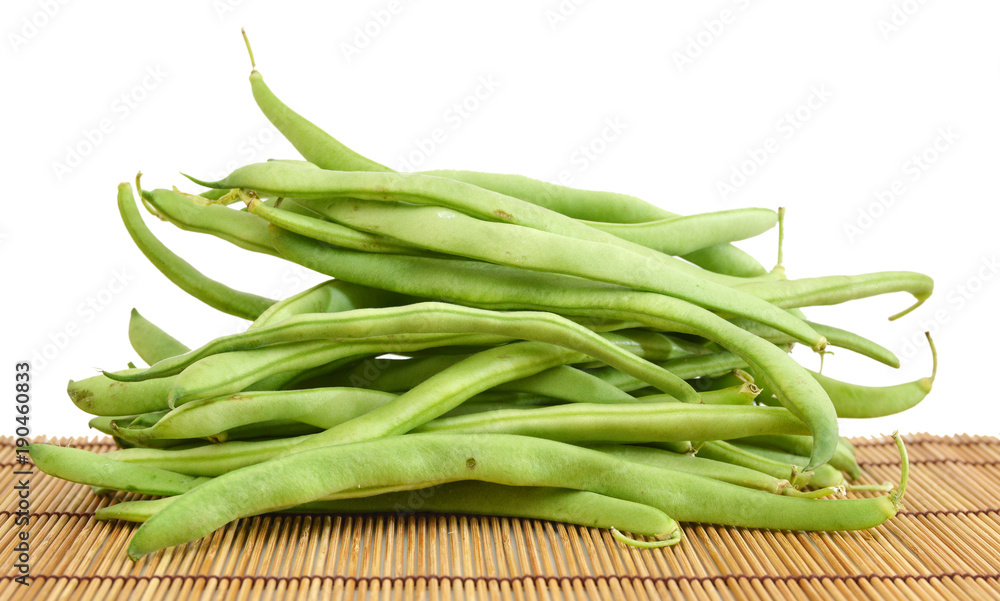 small and slender green beans (haricot vert) on a bamboo mat small and slender green beans (haricot vert) on a bamboo mat