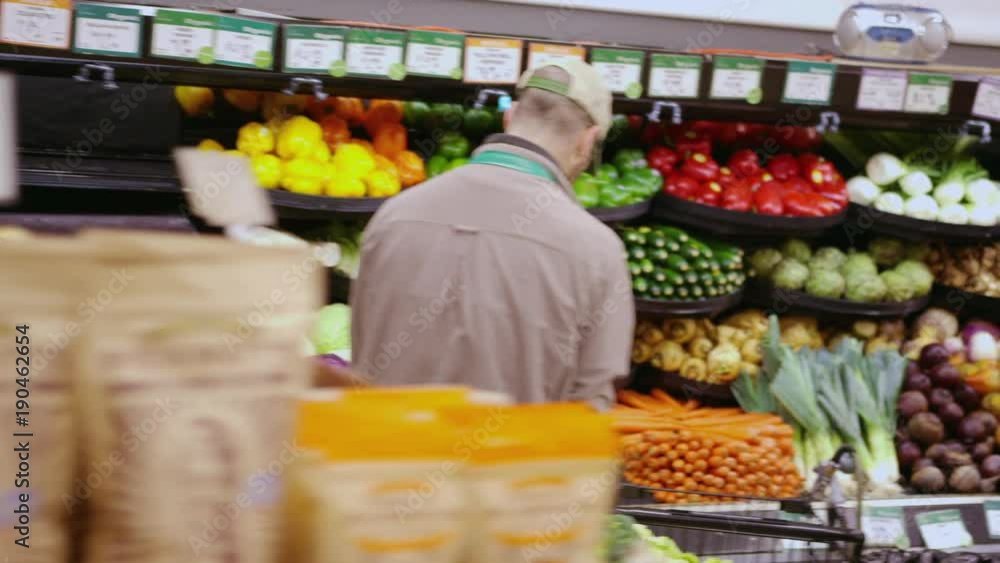 Handheld shot of workers working at supermarket