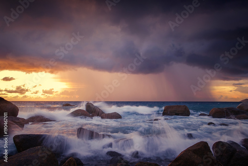 Seascape of wave and strom on rock , Long Exposure at Sunset on the beach in Phuket Thailand.
