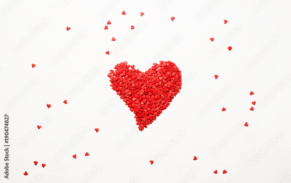 Red heart from sweet sugar hearts, Valentine's Day card, light background, top view Red heart from sweet sugar hearts, Valentine's Day card, light background, top view