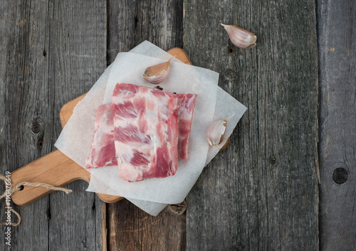 fresh pork ribs on a cutting Board, wooden background