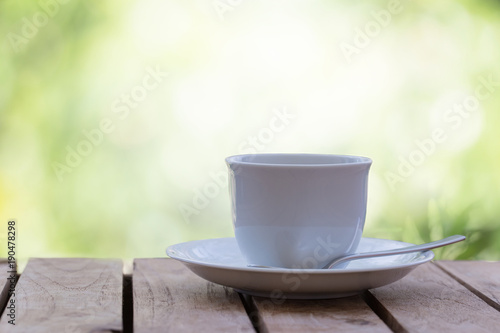 Hot black coffee on a natural background blurred bokeh