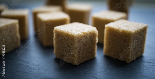 sugar cubes on a dark background. close up view