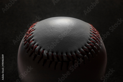 Baseball on black background.