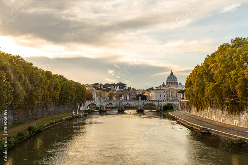 Late autumn early winter view on Vatican's Saint Peter Cathedral, or simply St. Peter's Basilica, and Ponte Vittorio Emanuele II, a bridge in Rome, Italy, constructed by the architect Ennio De Rossi
