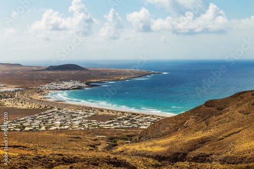 View on the Famara village  a famous surfing and kiting resort on Lanzarote  Canary Islands  Spain