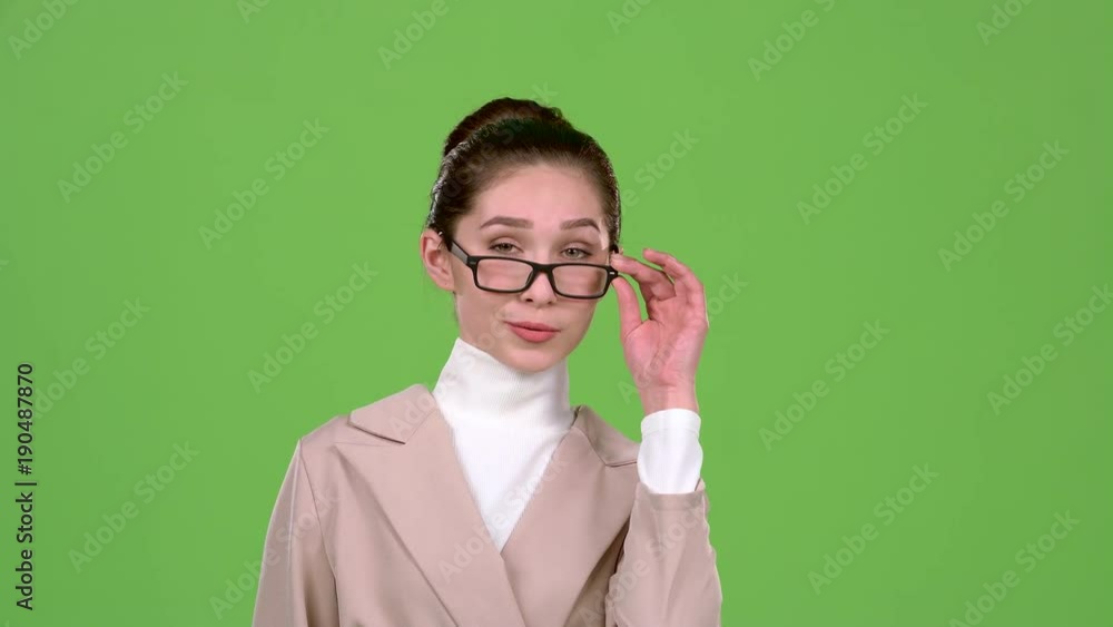 Businesswoman flirts and builds eyes to the guys. Green screen Businesswoman flirts and builds eyes to the guys. Green screen