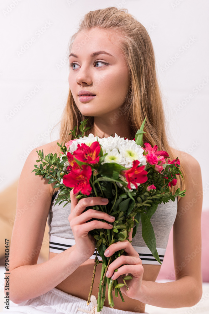 close-up portrait of young woman with beautiful bouquet close-up portrait of young woman with beautiful bouquet