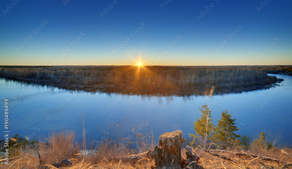 Evening landscape with a river, at sunset. Photographed in the central part of Russia.