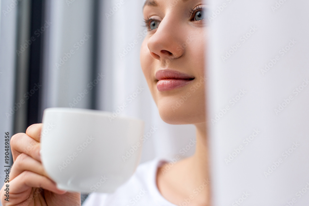 close-up portrait of young woman drinking coffee close-up portrait of young woman drinking coffee