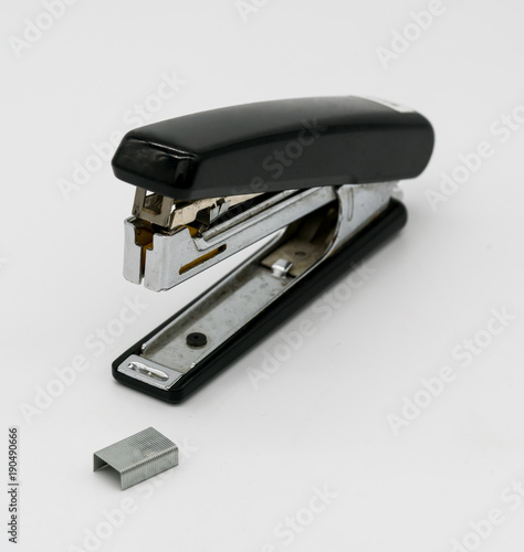 Broken black staple isolated on white background