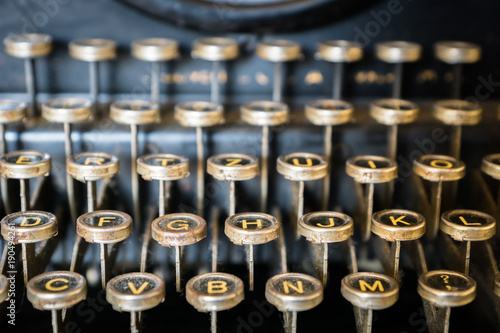 old typewriter keyboard close-up - vintage antique style typewriter