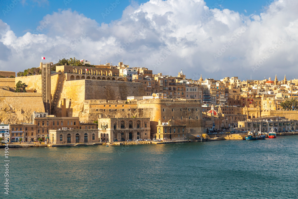 View on Valletta, capital city of Malta from the Grand Harbour with docks, The Saluting Battery and Barakka Lift.