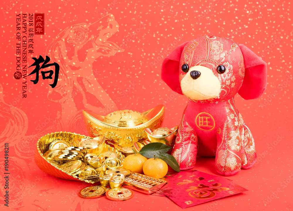Obraz premium Tradition Chinese cloth doll dog,calligraphy translation:year of the dog,red stamp mean: year of the dog