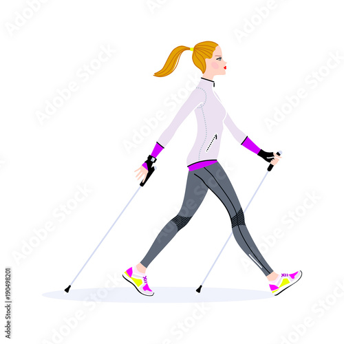 Young beautiful woman walking with the sticks for nordic walking.