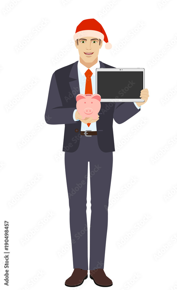 Businessman holding a piggy bank and digital tablet Businessman holding a piggy bank and digital tablet