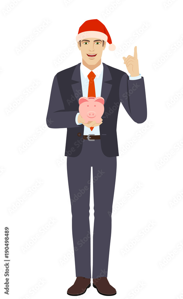 Businessman holding a piggy bank and pointing up Businessman holding a piggy bank and pointing up