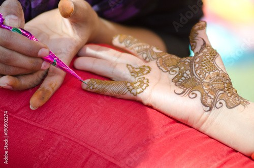 applying henna on hand, Hindu wedding ,Rajasthan, India © N | R