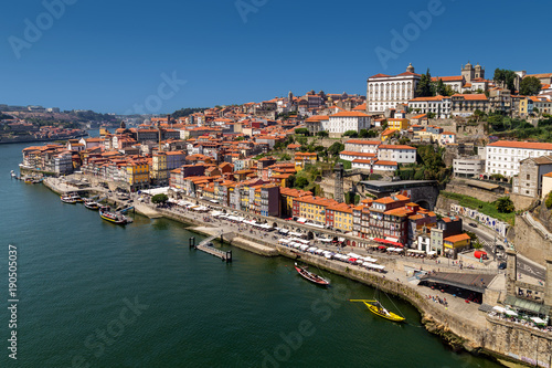 View on old town and historic centre of Porto, Oporto in Portuguese, Portugal as seen from Louis Pont Bridge. Popular touristic destination for port and wine tasting.