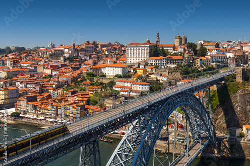 View on old town and historic centre of Porto  Oporto in Portuguese  Portugal as seen from Louis Pont Bridge. Popular touristic destination for port and wine tasting.
