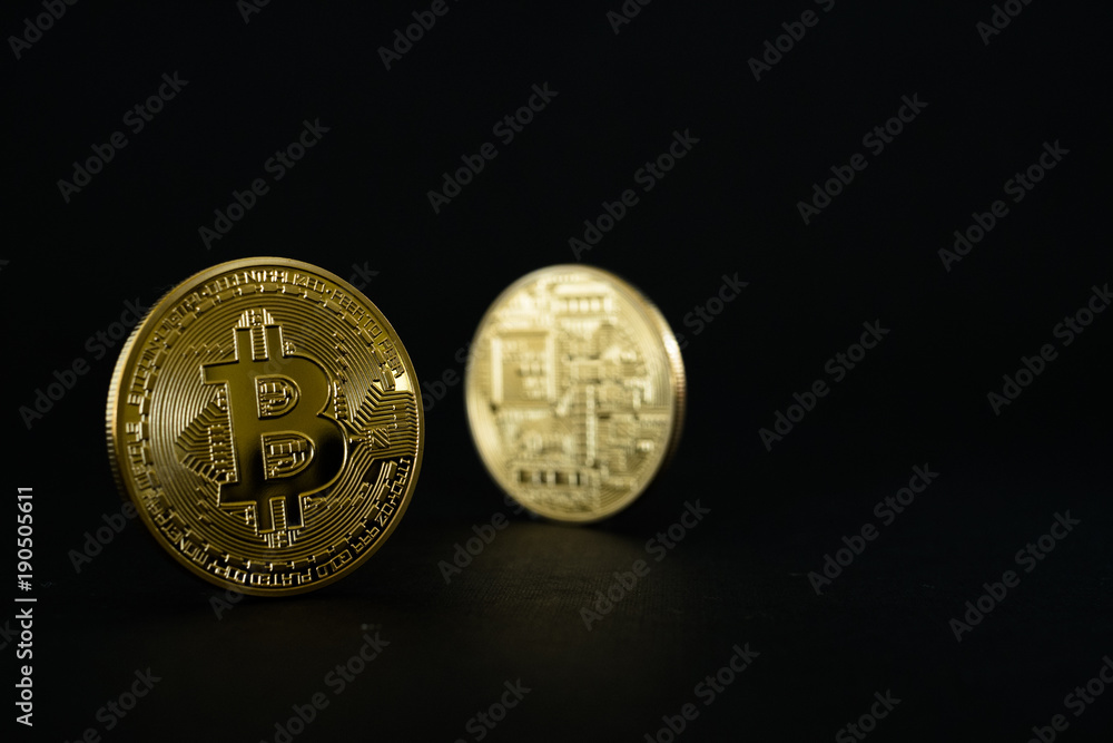 Gold Bitcoins isolated on black background