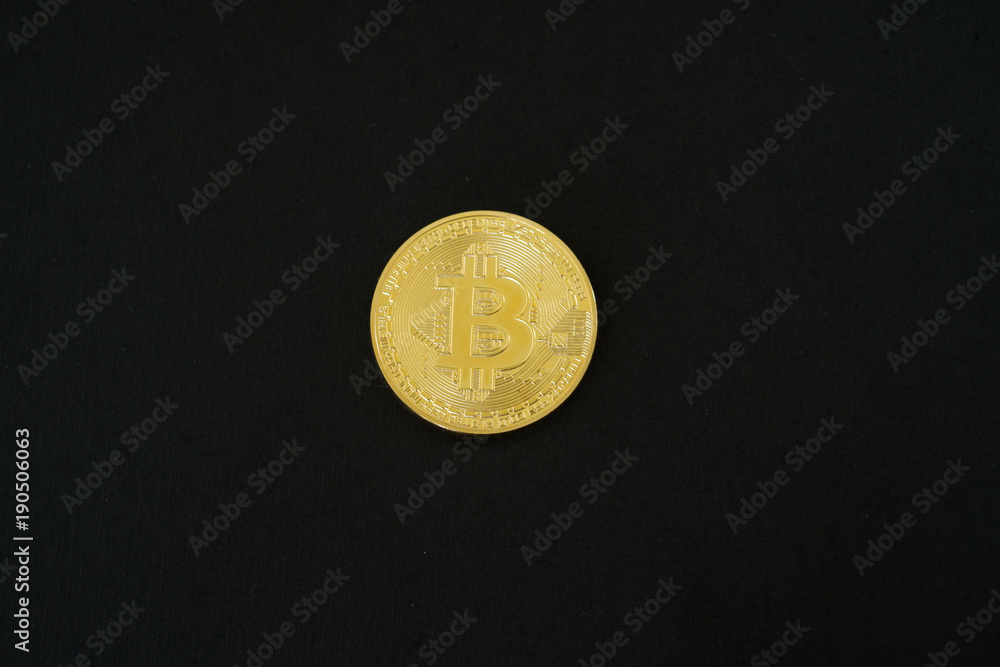 Gold Bitcoins isolated on black background