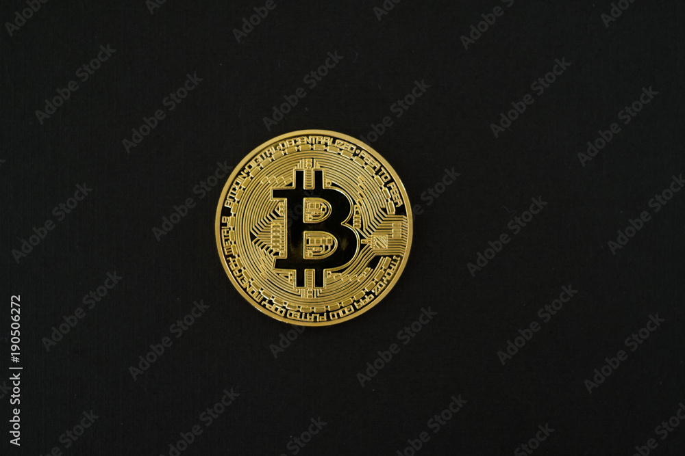 Gold Bitcoins isolated on black background