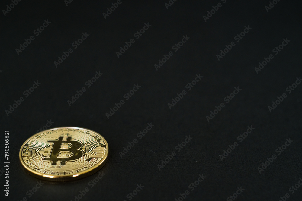 Gold Bitcoins isolated on black background