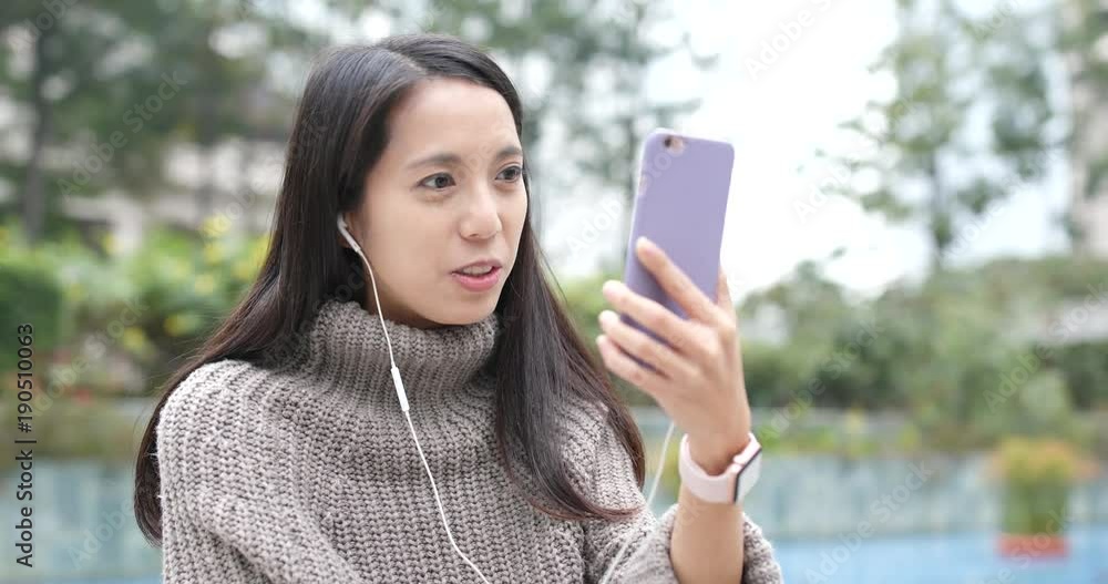 Woman making live stream on cellphone Woman making live stream on cellphone