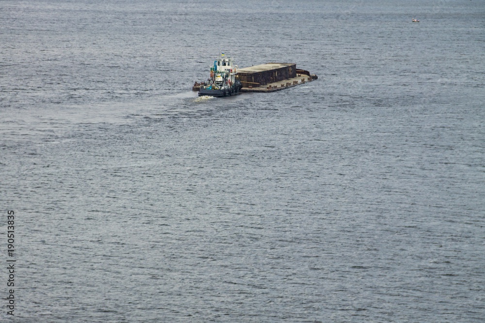 Obraz premium Barge floating on the Dnieper river