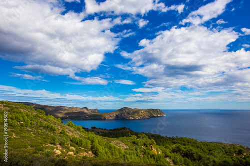 Panoramic views of the sea and mountains, rocky and hilly terrain on the coast of Costa Brava, the Mediterranean Sea in Spain, Catalonia en route to the city of Cadaques. In summer with the weather