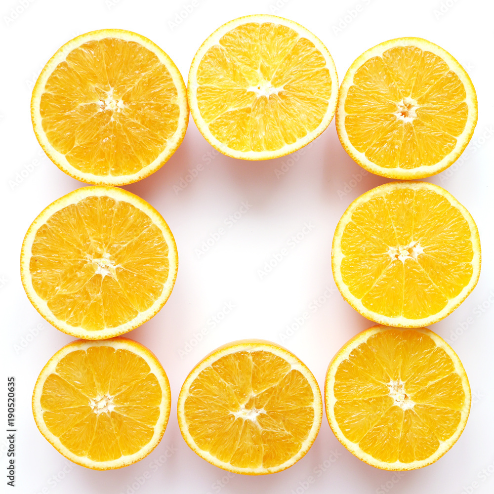 Creative flat layout of fruit, top view. Sliced orange isolated on white background. Food wallpaper, composition pattern of fresh citrus fruits.